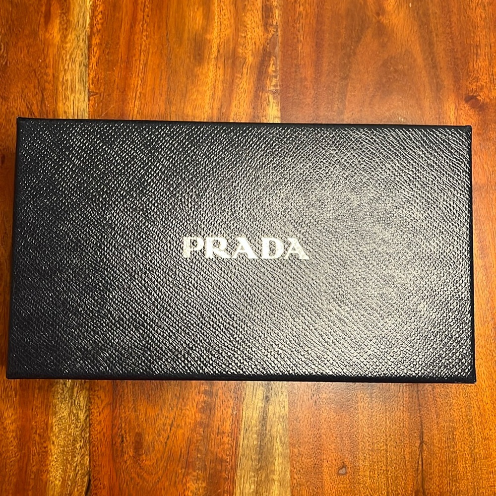 Used black Prada wallet box with tissue paper.